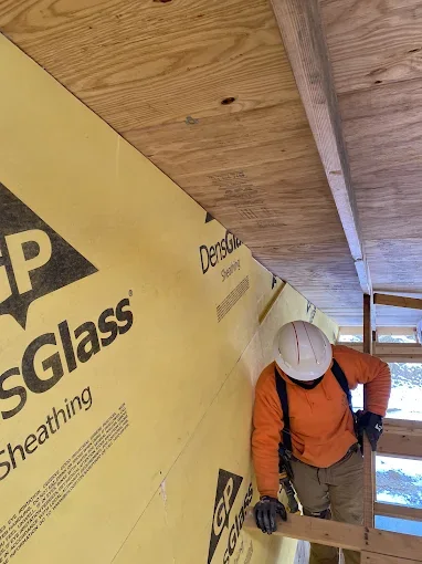 GOJ crew member installing glass-mat sheathing