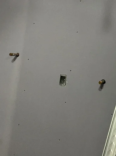 Drywall wall with clean cutouts ready for finishing