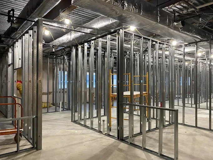 Interior metal stud partition framing for a commercial tenant build-out